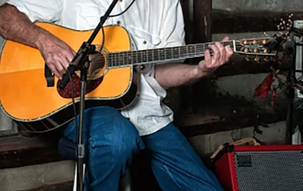 Malcolm playing guitar at a wedding
